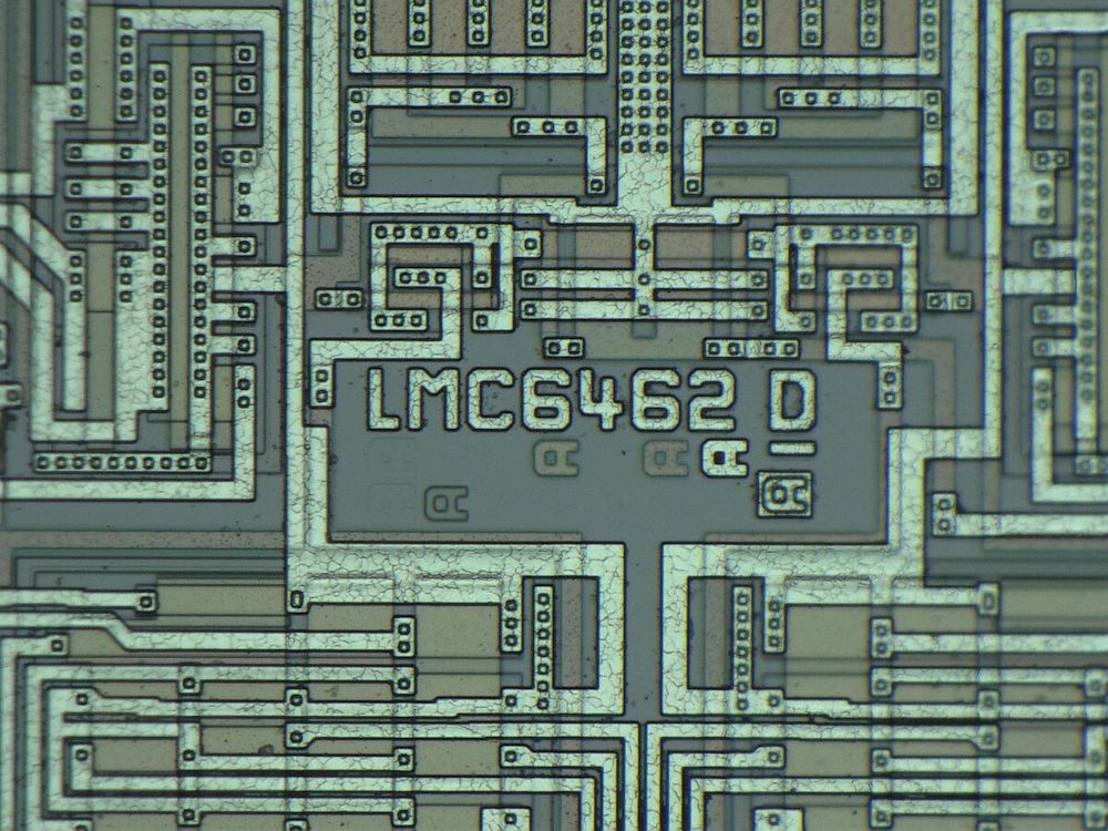 Close-up of an intricate electronic circuit board with the text 'LMC6462 D' printed on it.